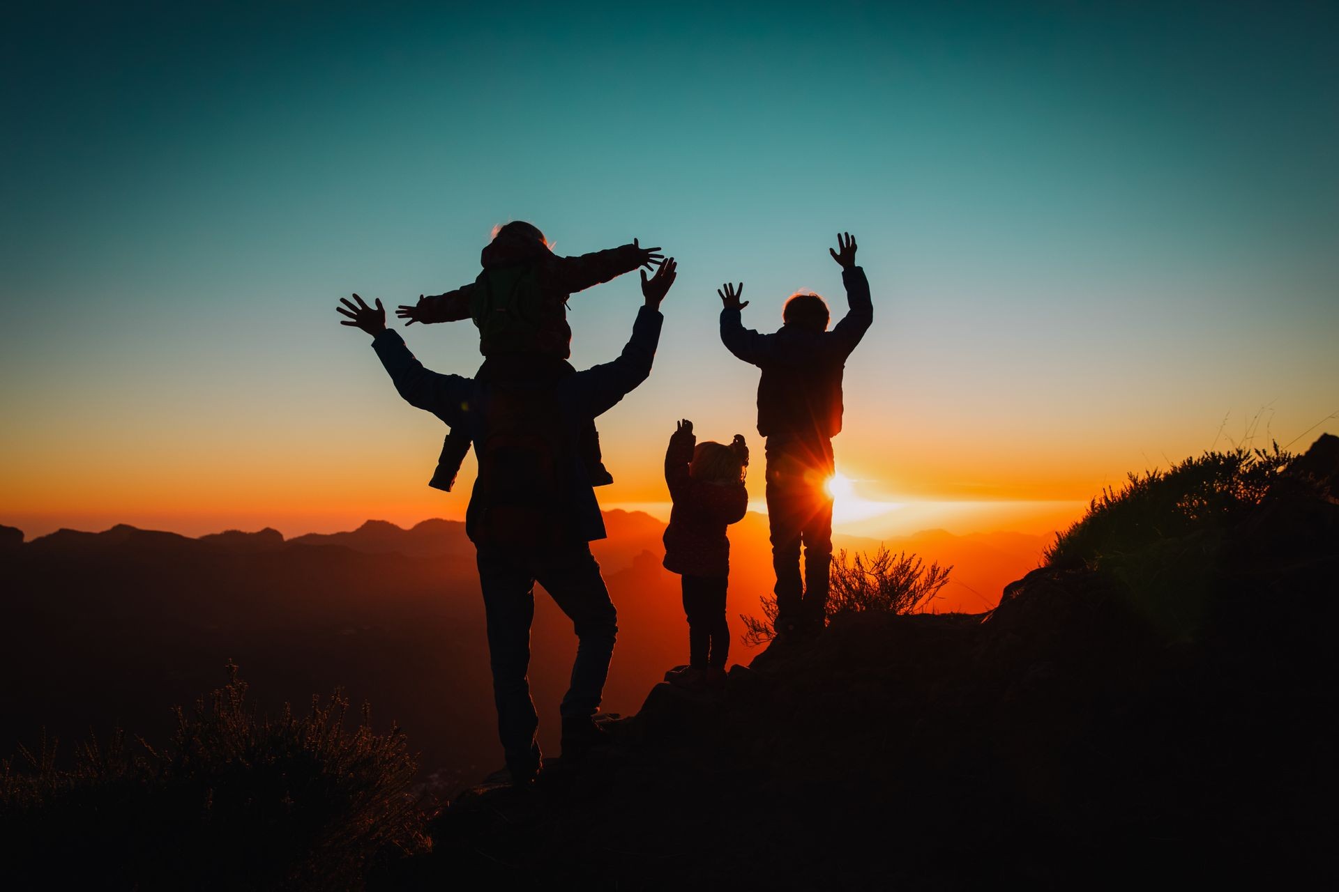 happy father with kids travel in sunset mountains, family hiking in nature
