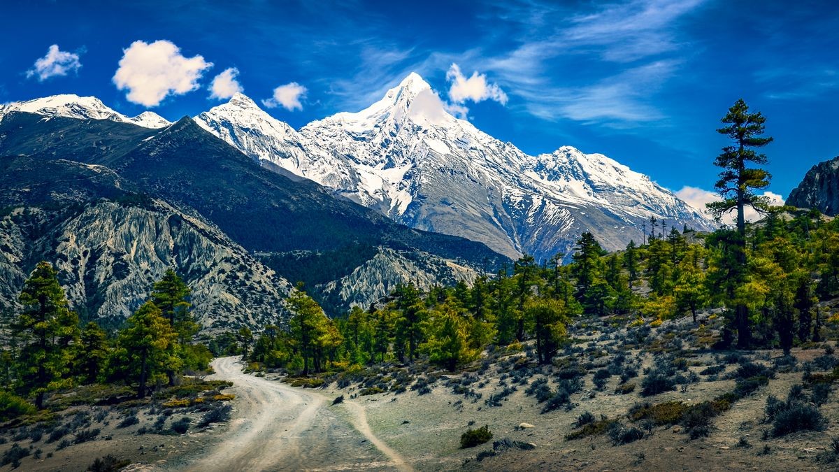 Mountains landscape view with snowed peaks and curvy road, Himalayas, Nepal, Asia